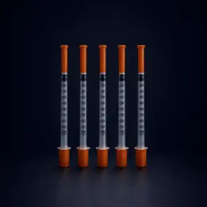Five Peptex 1ml mixing syringes with orange caps displayed on a premium dark background for laboratory research applications.